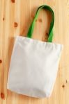 White Bag On Wood Background Stock Photo