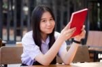 Asia Thai High School Student Uniform Beautiful Girl Read A Book Stock Photo