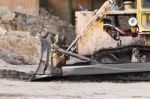 A Large  Bulldozer In Construction Site Stock Photo