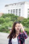 Asia Thai Teenager Women Scotch T-shirt Relax And Smile Stock Photo