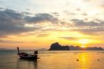 Boat On Beach And Sunrise Stock Photo