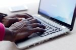 Handsome Young Man Working With His Laptop At Home Stock Photo