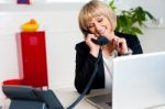 Secretary Attending Call Before Passing It To Boss Stock Photo