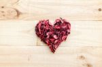 Heart Formed By Red Rose Petals On Wooden Background Stock Photo