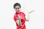 Asian Chinese Woman In Traditional Chinese Cheongsam Gesturing Stock Photo