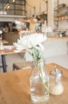 White Flower Decorated On Wooden Table Stock Photo