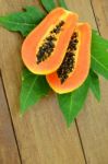 Ripe Papaya On Wood Background Stock Photo