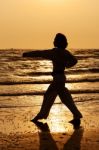 Martial Art Training In Silhouette Stock Photo