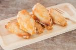 Grilled Chicken Wings On Wooden Plate Stock Photo