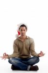 Christmas Guy Doing Meditation Stock Photo