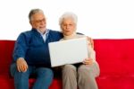 Elderly Couple With Laptop Stock Photo