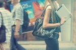 Young Woman With Tablet Computer Walking On Street Stock Photo