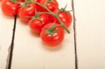 Fresh Cherry Tomatoes On A Cluster Stock Photo