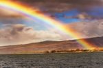 Rainbow Along Shoreline On Kauai Island Of Hawaii Stock Photo