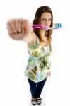 Pretty Woman Holding Brush Stock Photo