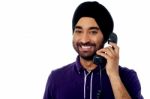 Smart Guy Answering The Phone Call Stock Photo