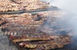 Traditional Meat Grilled On The Grill In The Argentine Countryside Stock Photo