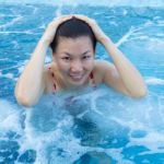 Asian Woman Enjoy And Relaxing In Spa Pool On Vacation Stock Photo