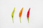 Chili Peppers On White Stock Photo