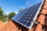 Row Of Solar Panels  On Roof Stock Photo