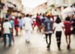 Blurred People Walking On The Street Stock Photo