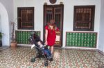 Mother And Son Standing At The House Stock Photo