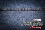 Jeans Word On Denim Background Stock Photo