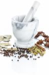 Marble Mortar And Pestle With Assorted Spices On White Backgroun Stock Photo