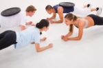 Young Multi Ethnic People Exercising In Gym Stock Photo