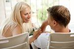 Couple Laughing On Balcony Stock Photo