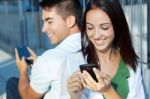 Young Couple With Smart Phone Stock Photo