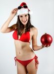 Sexy Santa Girl In Bikini Holding A Christmas Ball Stock Photo