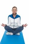 Portrait Of A Woman Sitting In A Lotus Position Stock Photo