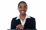 Pretty Female Executive Typing On Keyboard Stock Photo