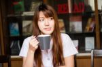 Portrait Of Thai Adult Student University Uniform Beautiful Drinking Coffee Stock Photo