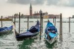 Gondolas Moored At The Entrance To The Grand Canal Stock Photo