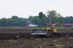 Grader Work On Dirty Ground Stock Photo