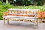 Old Wooden Bench In Beautiful Garden Background Stock Photo