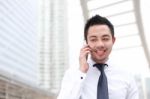 Asia Business Man Using A Mobile Phone With Copyspace Stock Photo