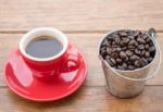 Red Cup Of Espresso On Wooden Table Stock Photo