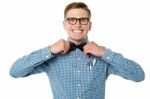 Nerd Guy Adjusting His Bow Tie Stock Photo