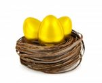 Golden Eggs In Nest Stock Photo