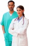 Confident Female Doctor Standing With Male Nurse Stock Photo