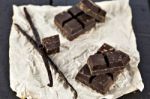 Chunks Of Dark Chocolate Bar And Vanilla Beans Stock Photo