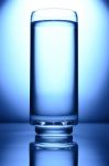 Glass Of Water Spot Light Blue Stock Photo