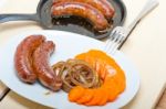 Beef Sausages Cooked On Iron Skillet Stock Photo