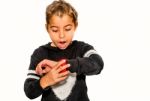 Eight Year Old Girl Looking At Her Watch Surprised At What Time It Is Stock Photo