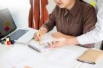 Two Young Men Working As Fashion Designers And Drawing Sketches Stock Photo