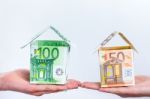 Two Hands Showing Euro Bills Houses Stock Photo