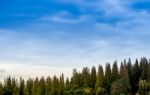 Sunrise Landscape Of Foggy And Cloudy Mountain Valley Stock Photo